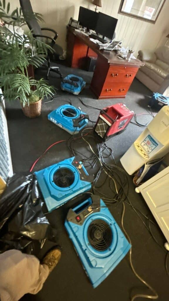 Commercial water damage drying setup with air movers and dehumidifier in Hendersonville, TN