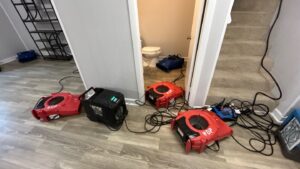 Storm water damage drying setup in a Nashville home with air movers and dehumidifier